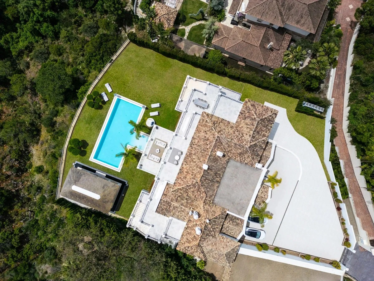 Aerial view of the villa, terraces and pool in El Madroñal