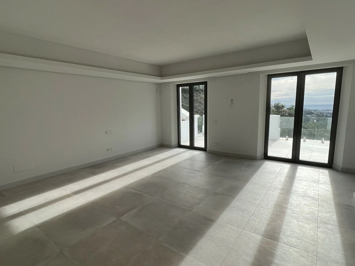 Principal bedroom before furnishing, opening onto a terrace