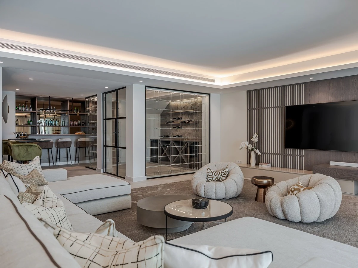 Entertainment lounge with a television wall, wine display and bar