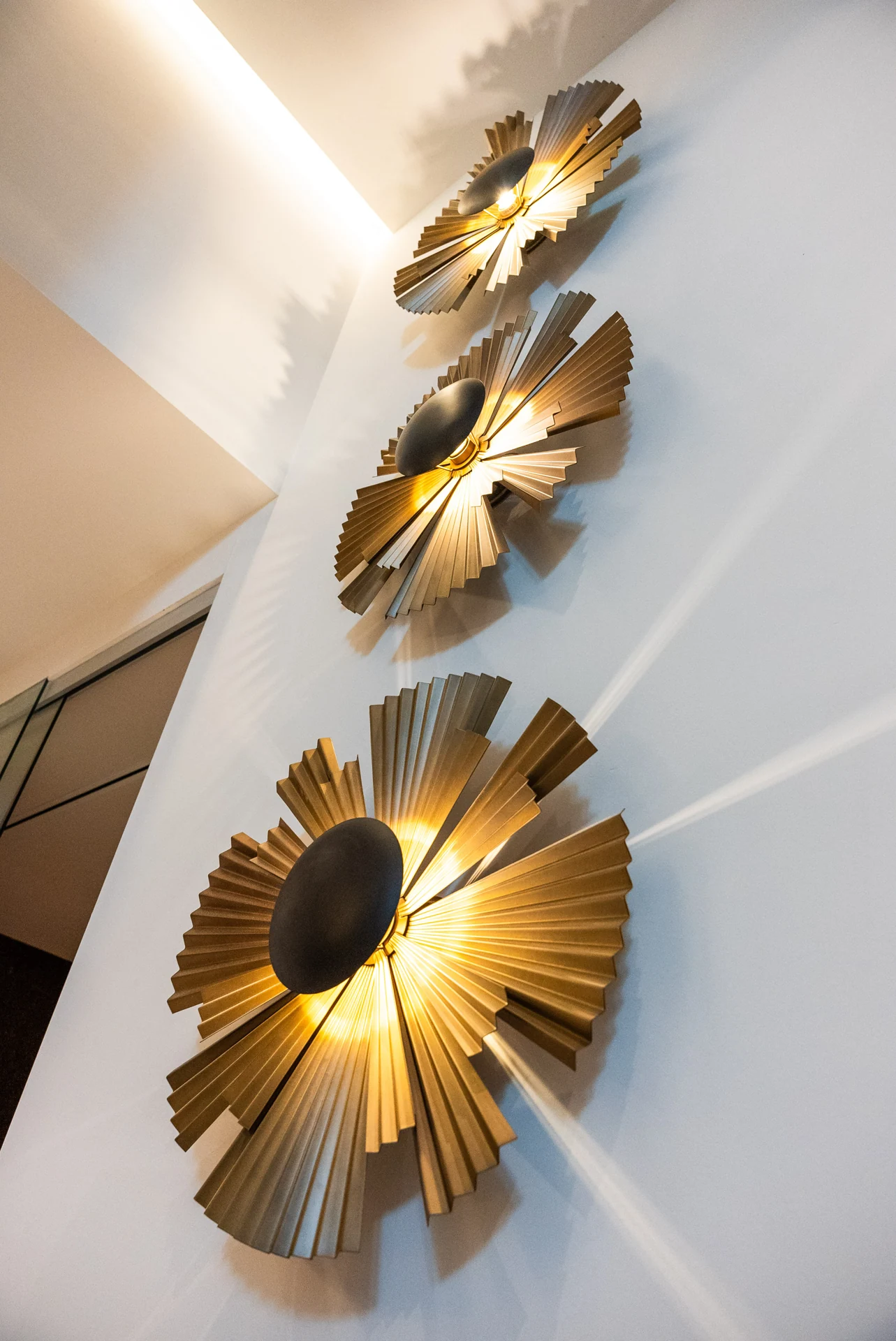 Sculptural wall decoration beside the staircase