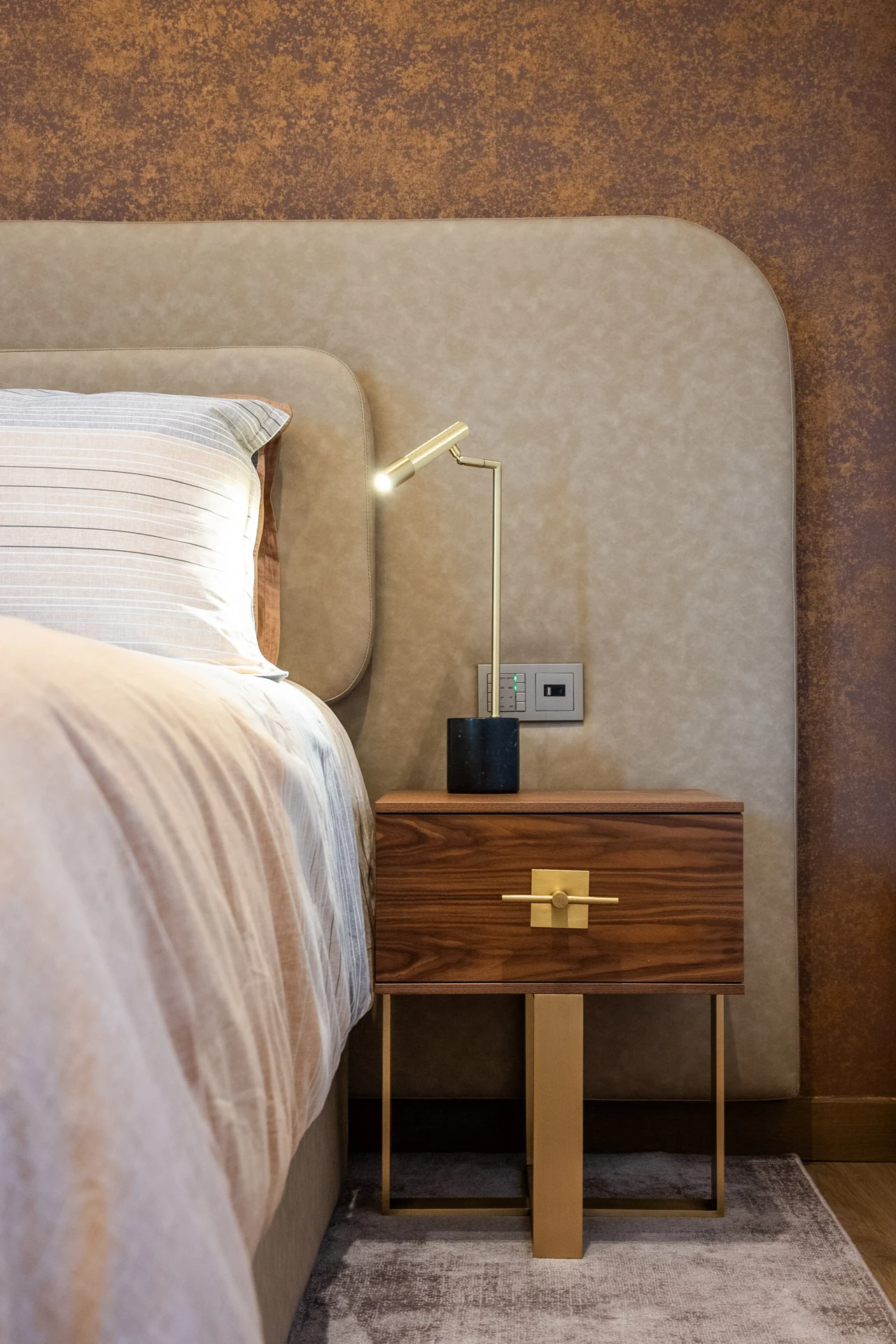 Neutral bed upholstery and timber bedside furniture