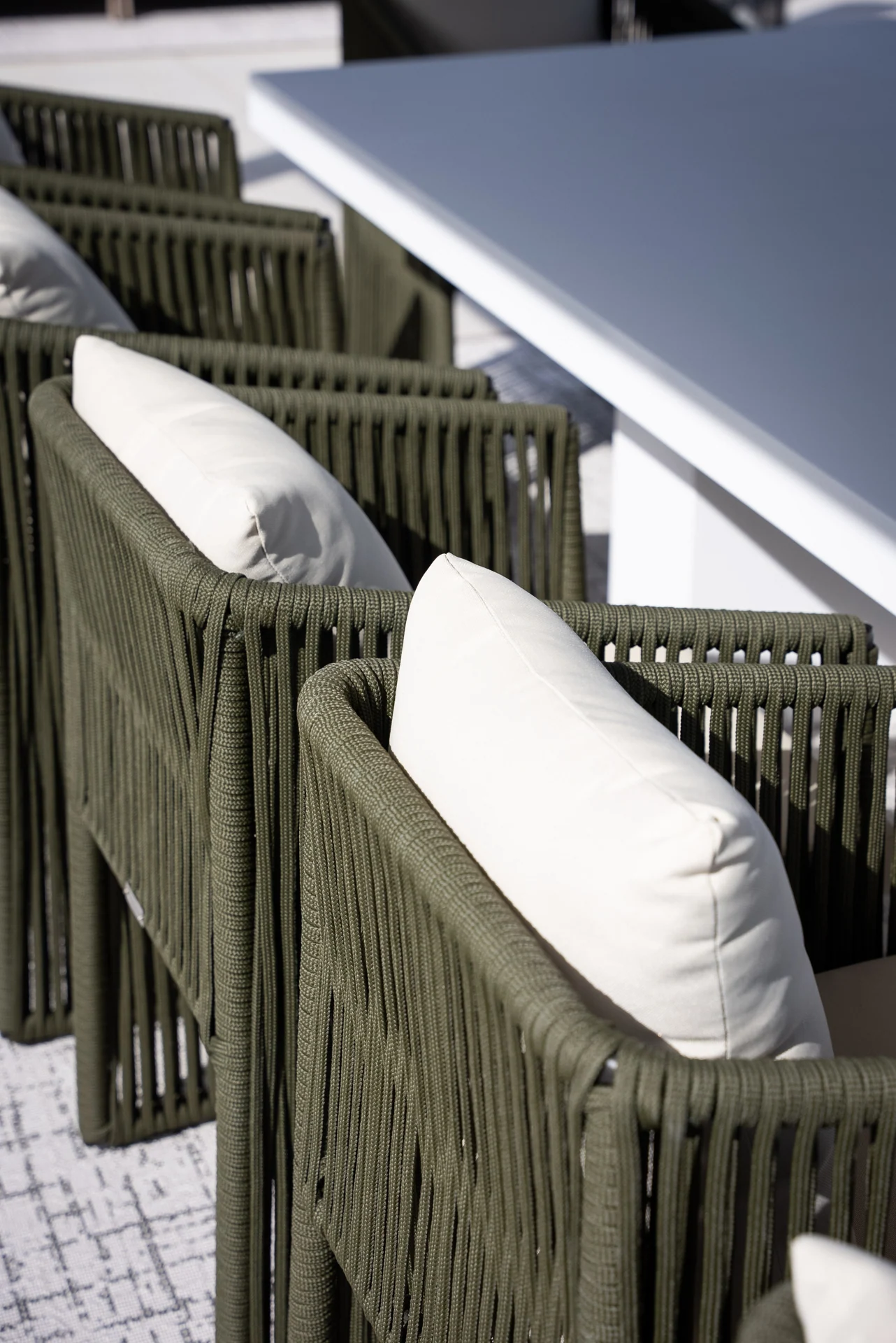 Outdoor dining chairs beneath the roof pergola