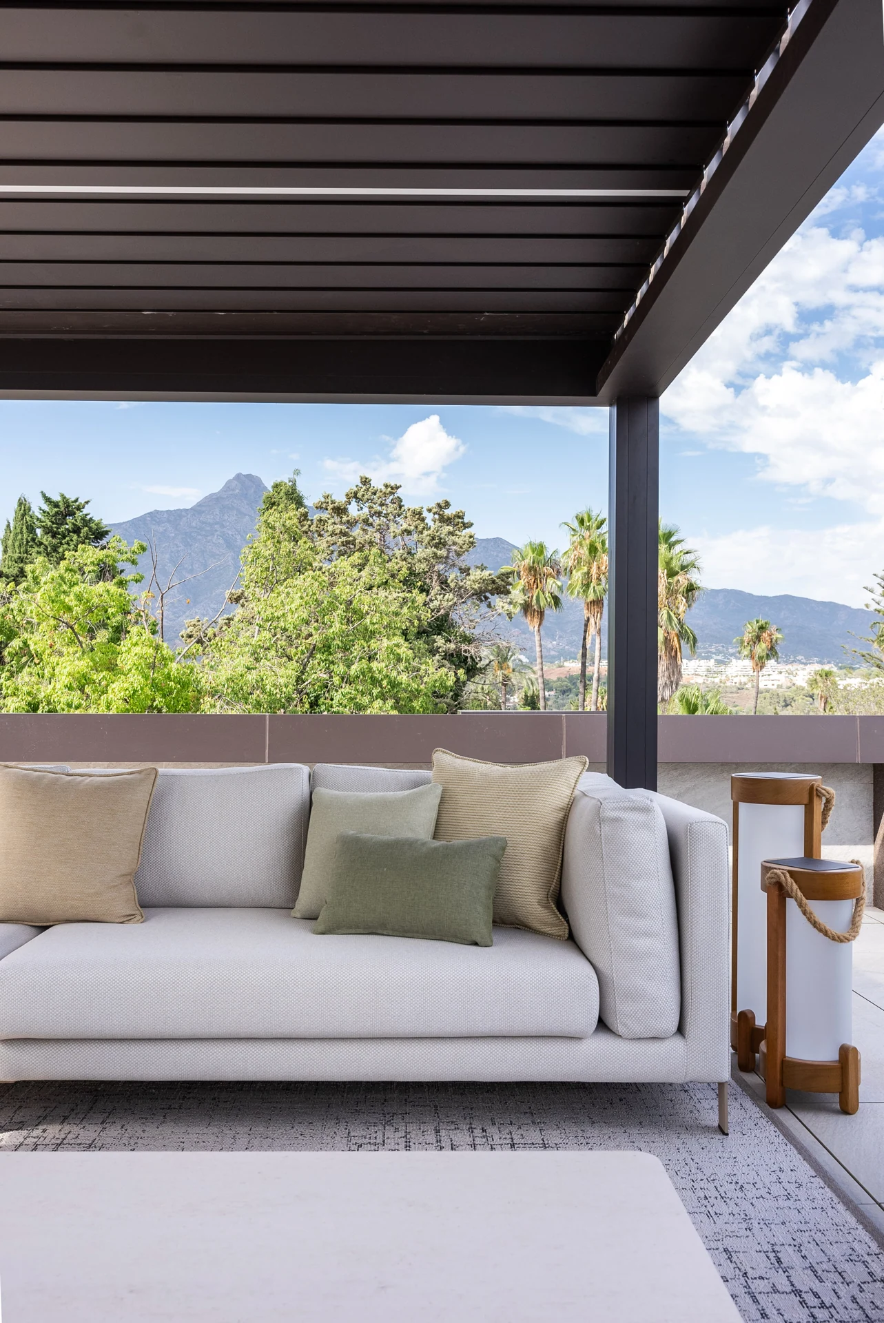 Terrace seating framed by greenery