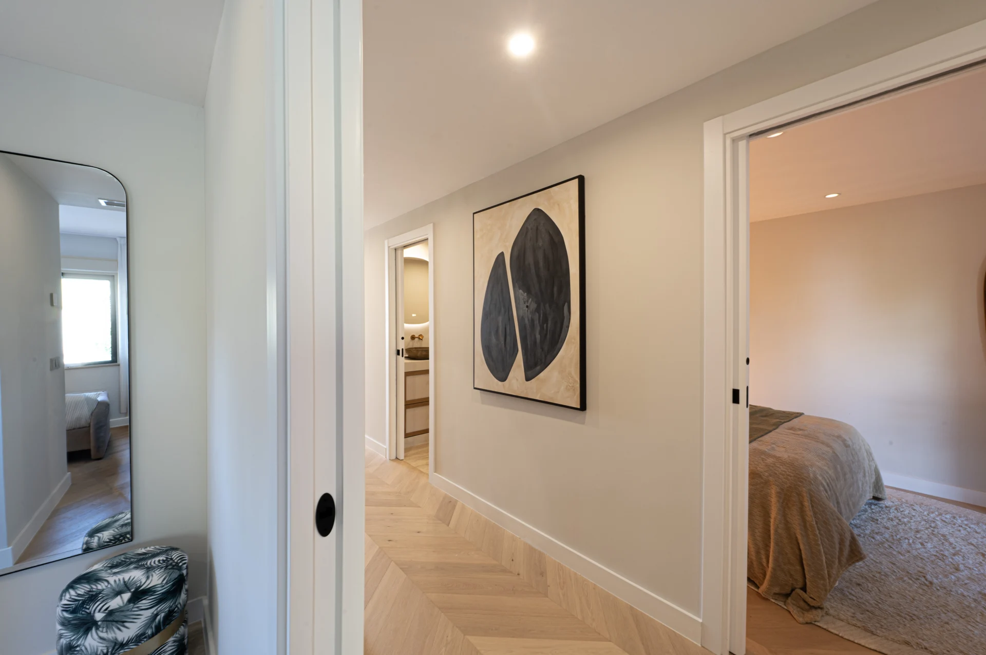 Entrance hallway leading into a softly furnished bedroom